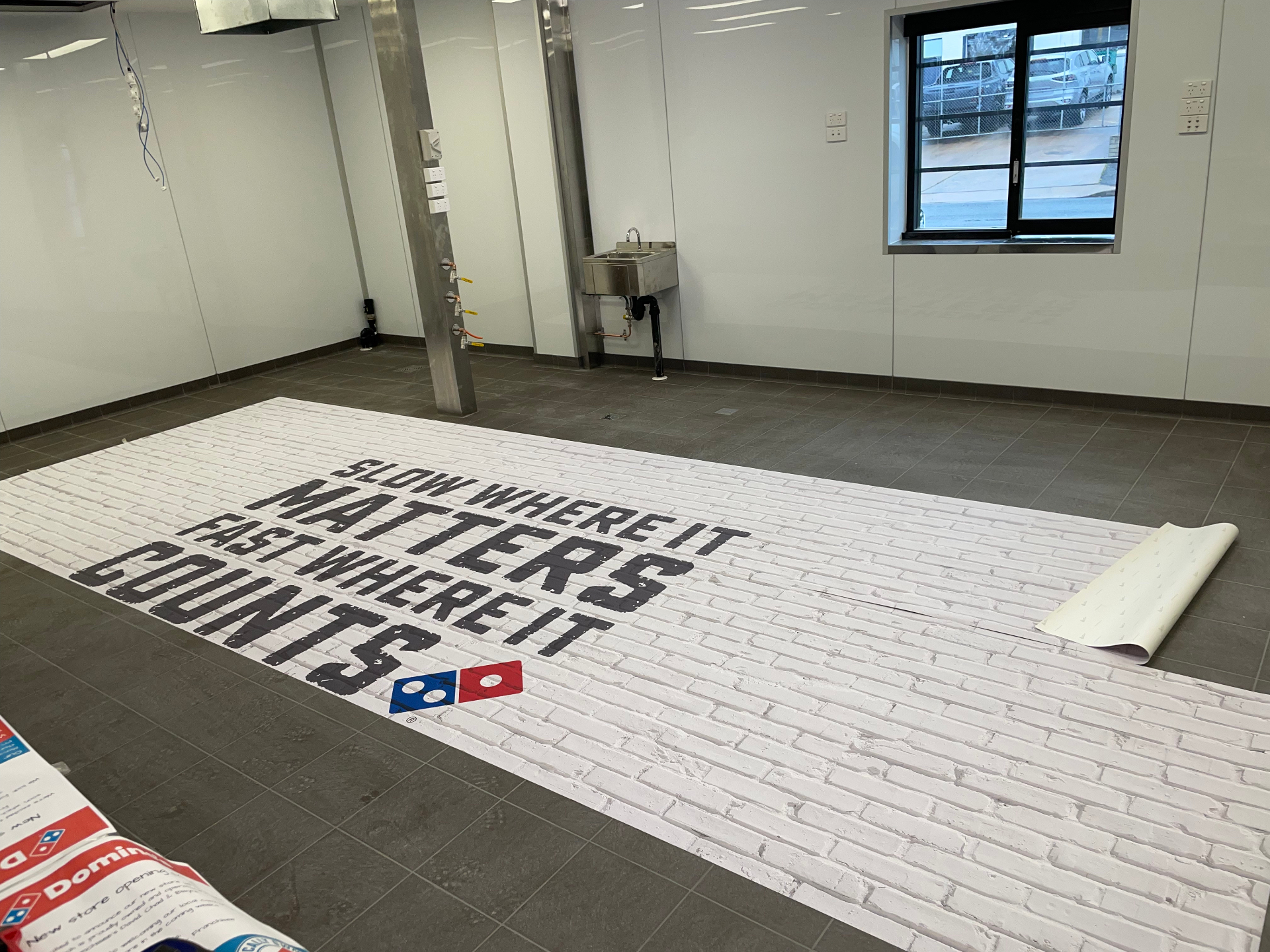 Printed wall wrap laid out prior to install