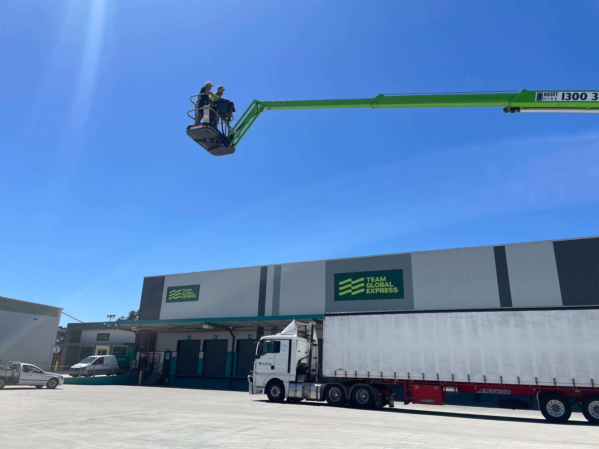 Boom-lift install alongside live freight operations