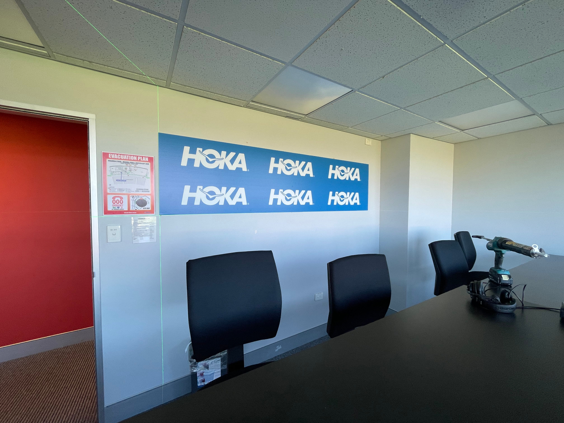 HOKA-branded media backdrop in the press interview room