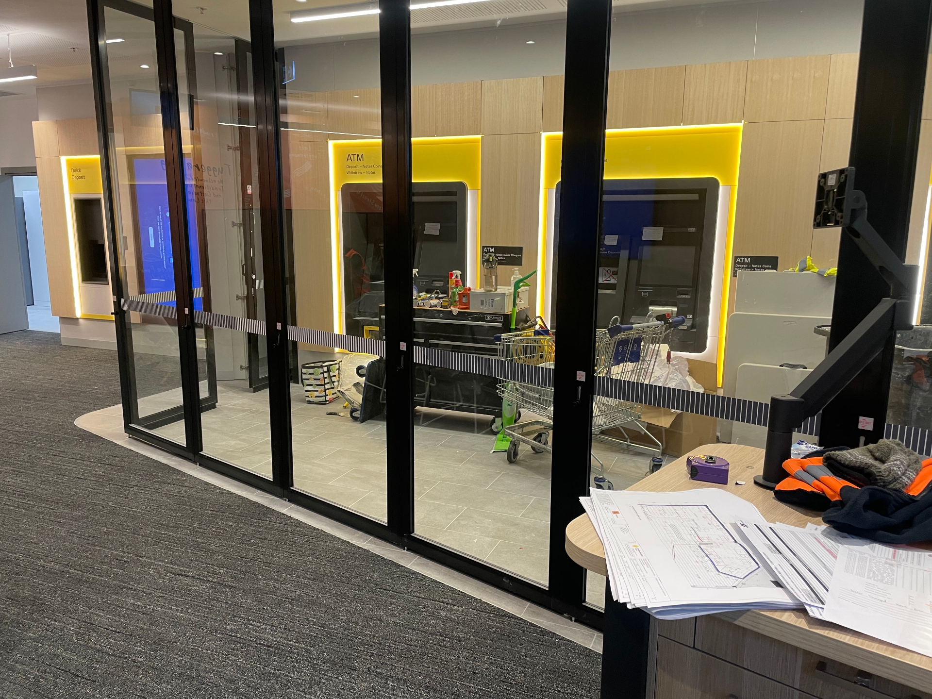 Illuminated ATM surrounds and glass banding