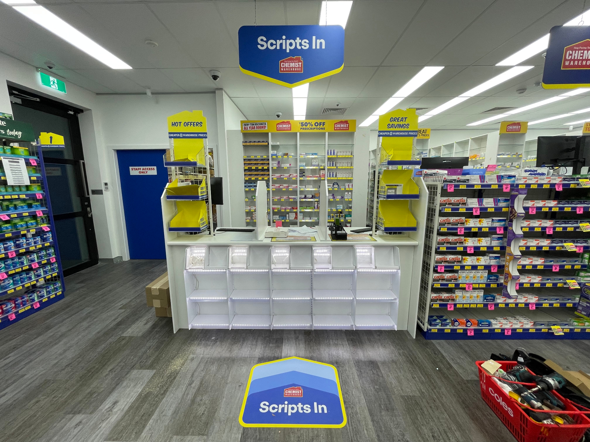 Finished Scripts In counter with illuminated blade sign and floor decal