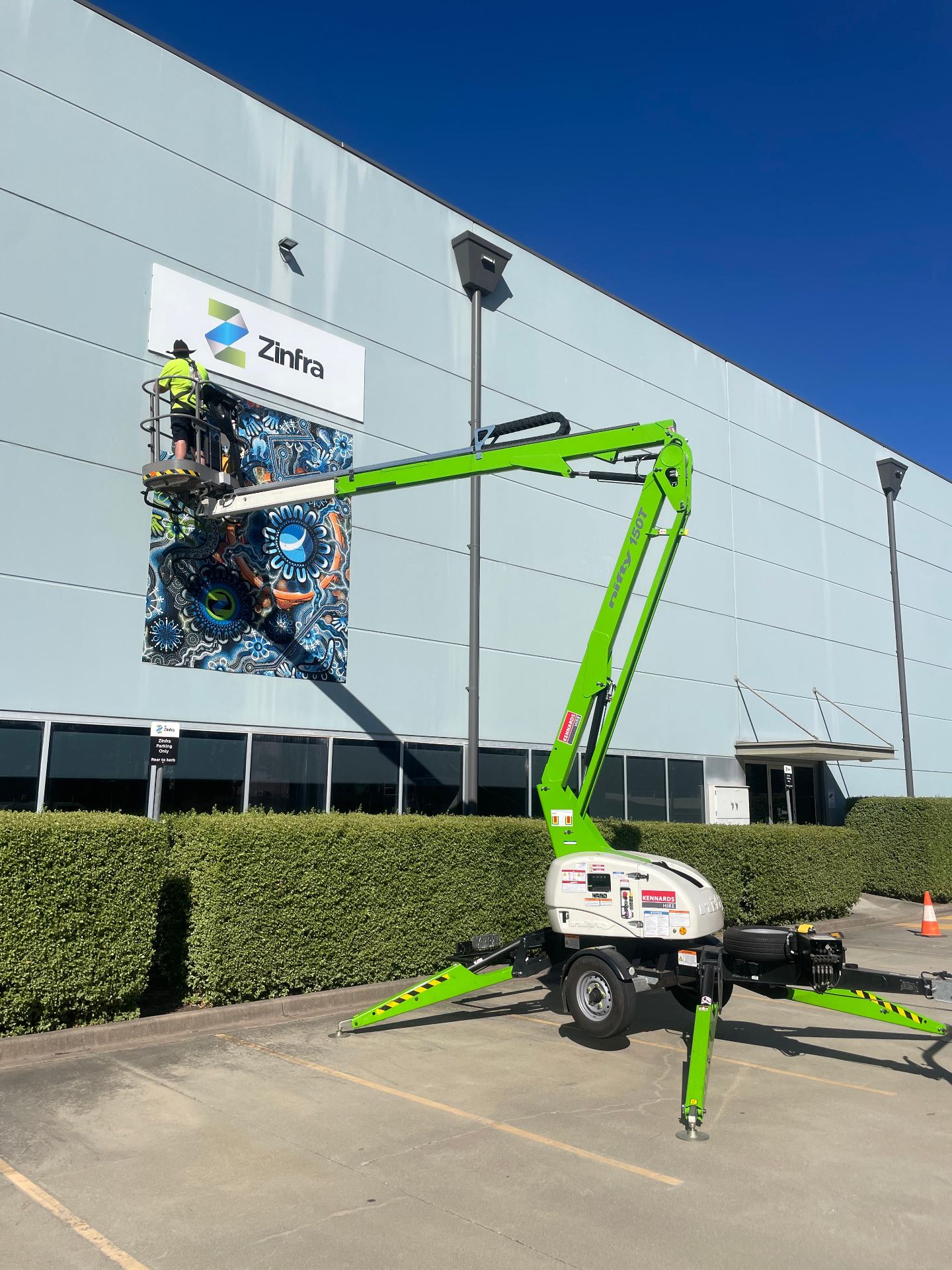 Artwork panel install from articulated boom