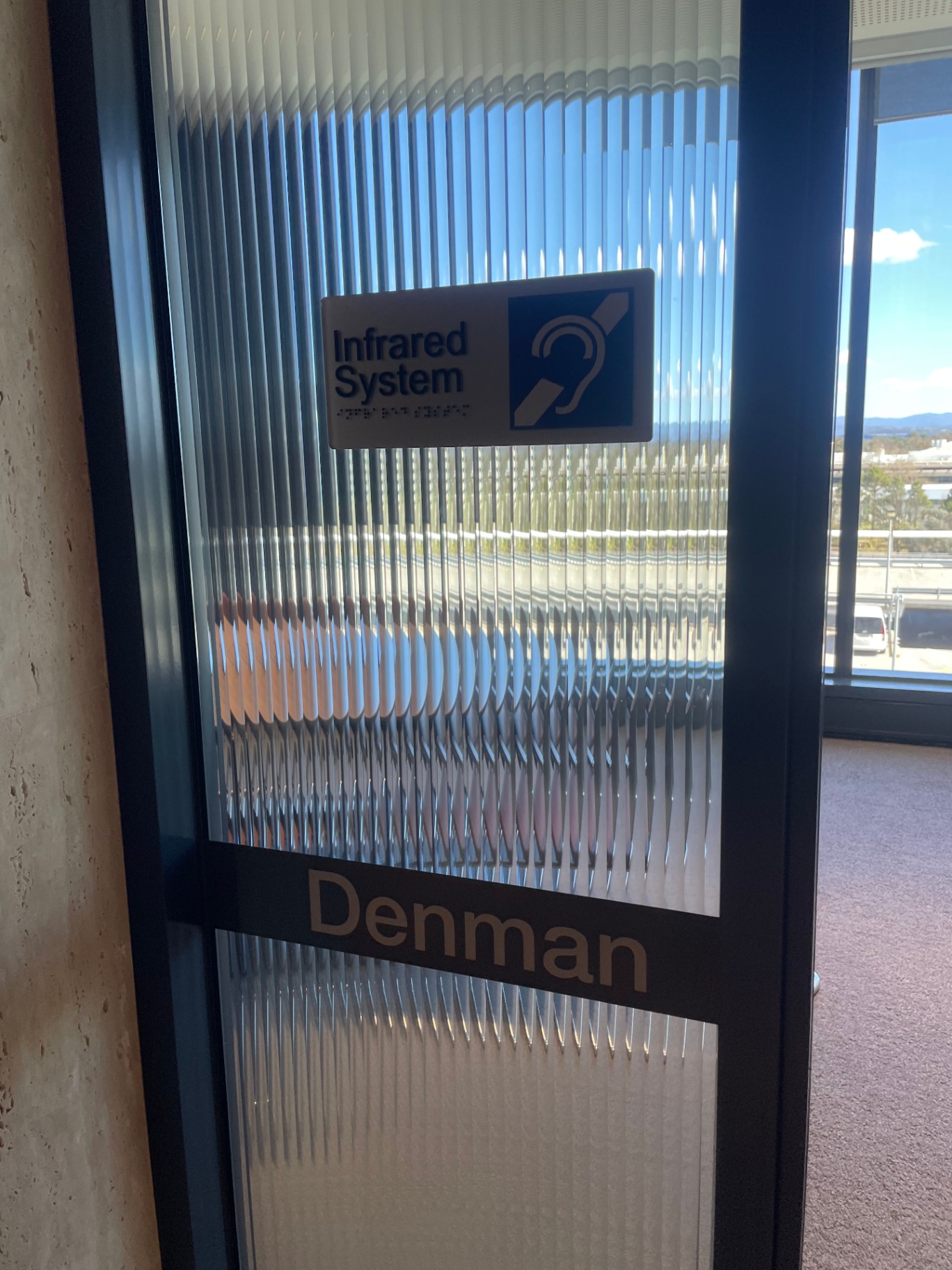 Accessible hearing assistance room sign